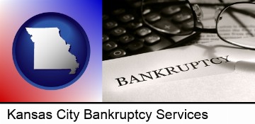 a bankruptcy notice letter with calculator and eyeglasses in Kansas City, MO